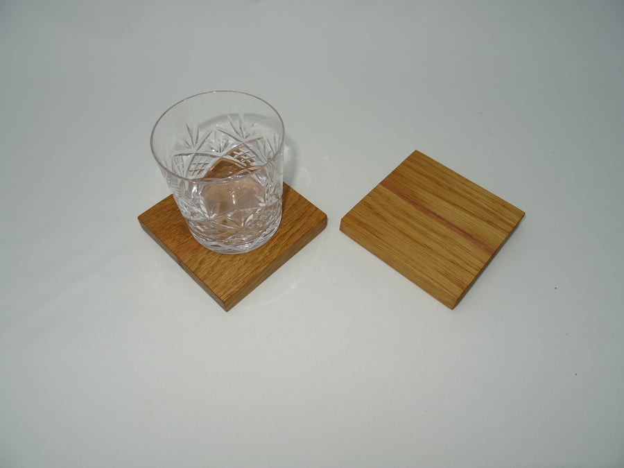 Pair of drinks coasters in Oak with Black Walnut stripe