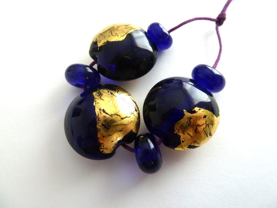 blue and gold leaf lampwork beads