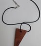 Handmade wooden pendant is crafted from reclaimed teak