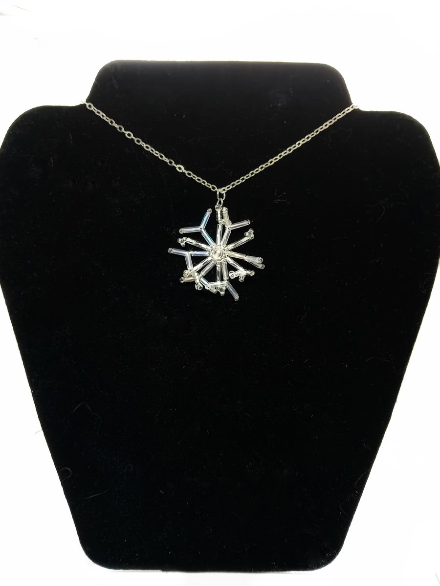 Silver and white beaded snowflake pendant necklace on trace silver chain