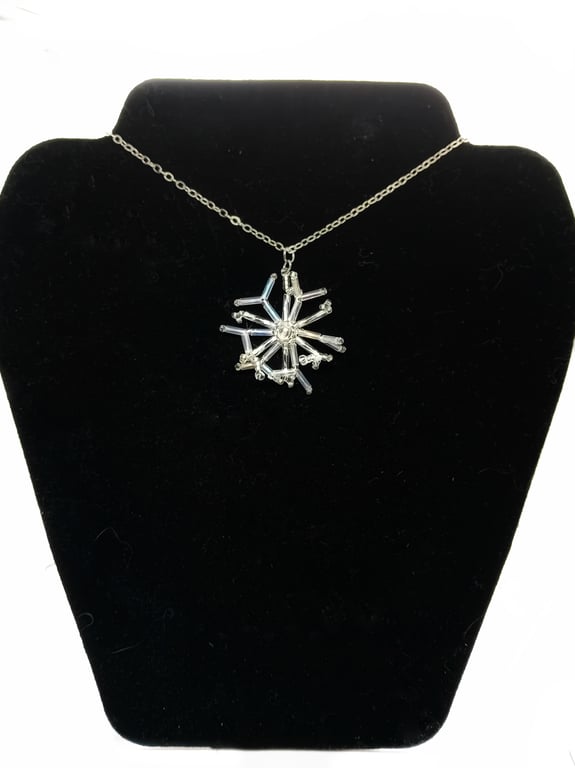 Silver and white beaded snowflake pendant necklace on trace silver chain