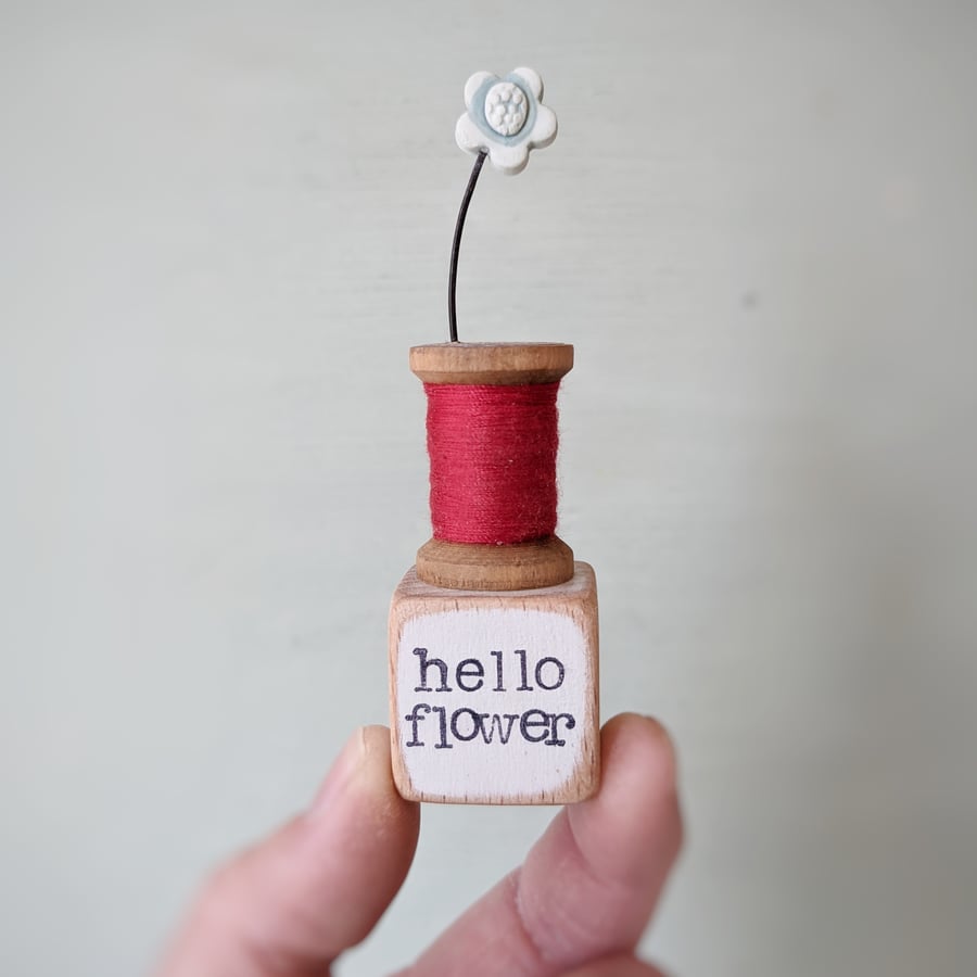 Clay Flower on a Teeny Vintage Bobbin 'hello flower'