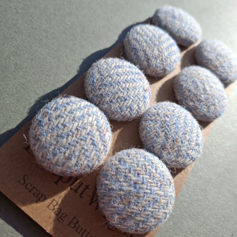Set of eight scrap bag buttons -baby blue and oatmeal Harris Tweed