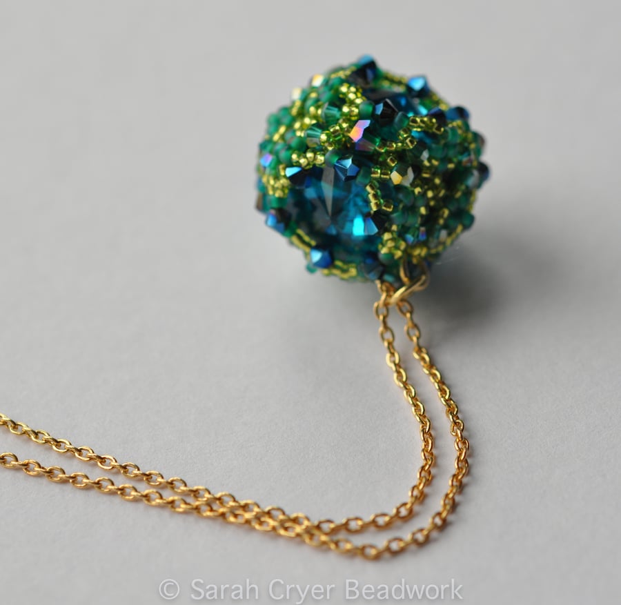 Turquoise and lime beadwoven crystal ball pendant
