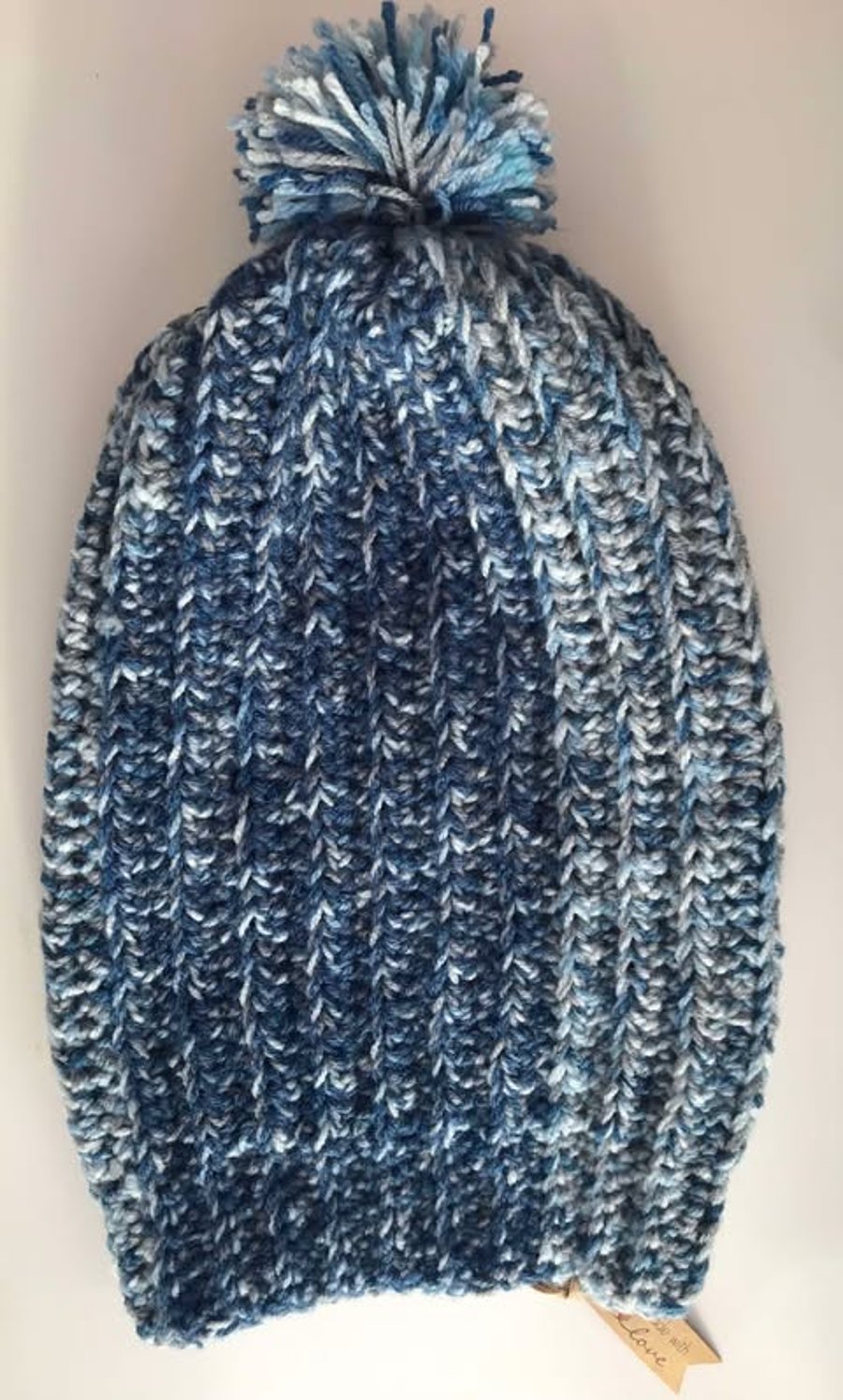 Handmade crocheted ribbed hat with tassel
