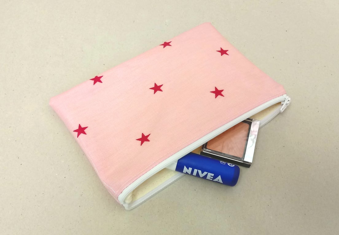 Make up bag in pink oilcloth with stars, cream lining, handmade