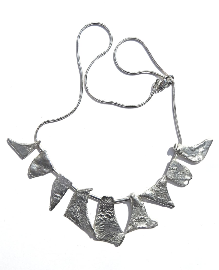 N25 Necklace of burnt silver units on a silver snake cahin with lobster claw cla