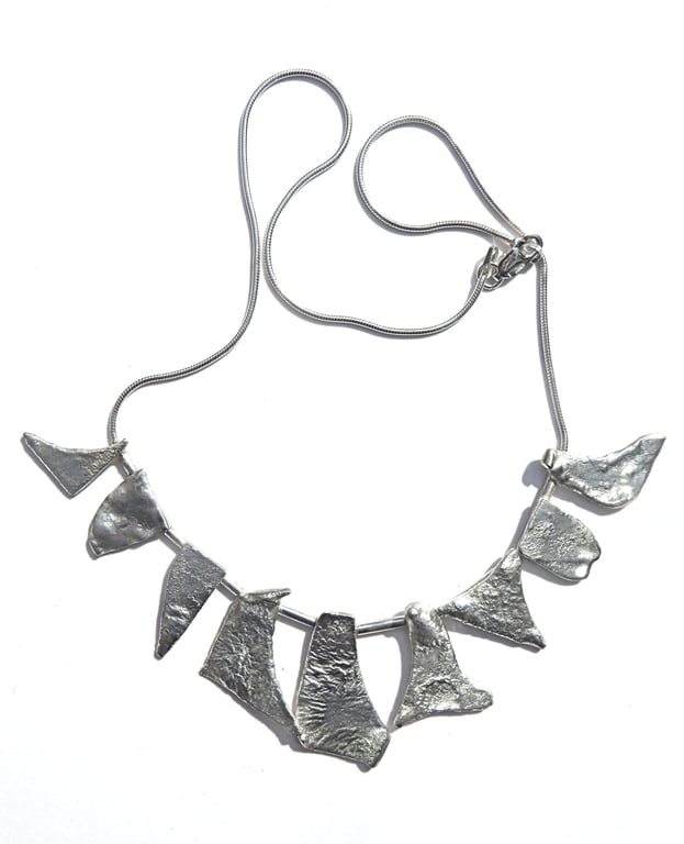 N25 Necklace of burnt silver units on a silver snake cahin with lobster claw cla