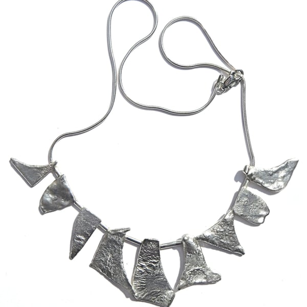 N25 Necklace of burnt silver units on a silver snake cahin with lobster claw cla