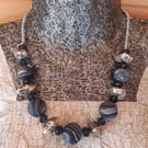 Statement necklace in navy, dark grey and black 