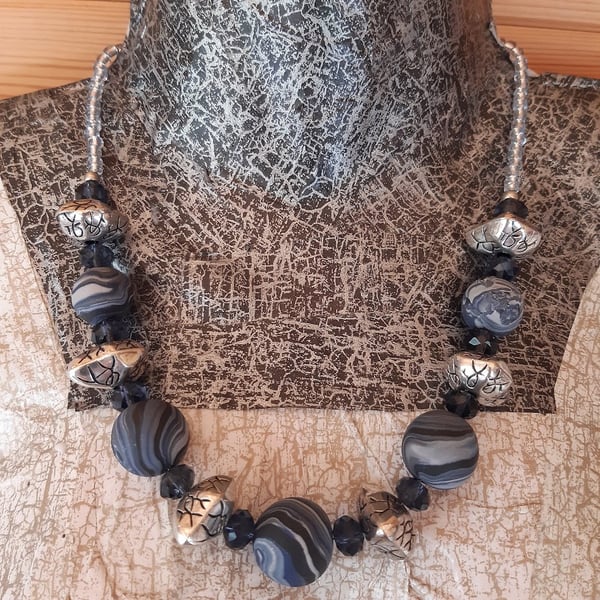 Statement necklace in navy, dark grey and black 