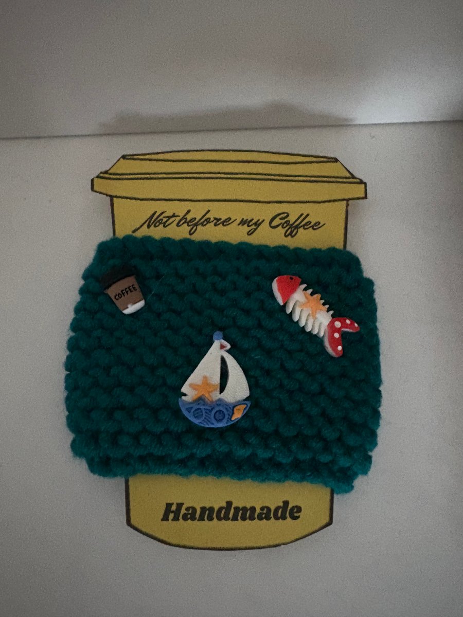 Fishing hand knitted cup cosy. 
