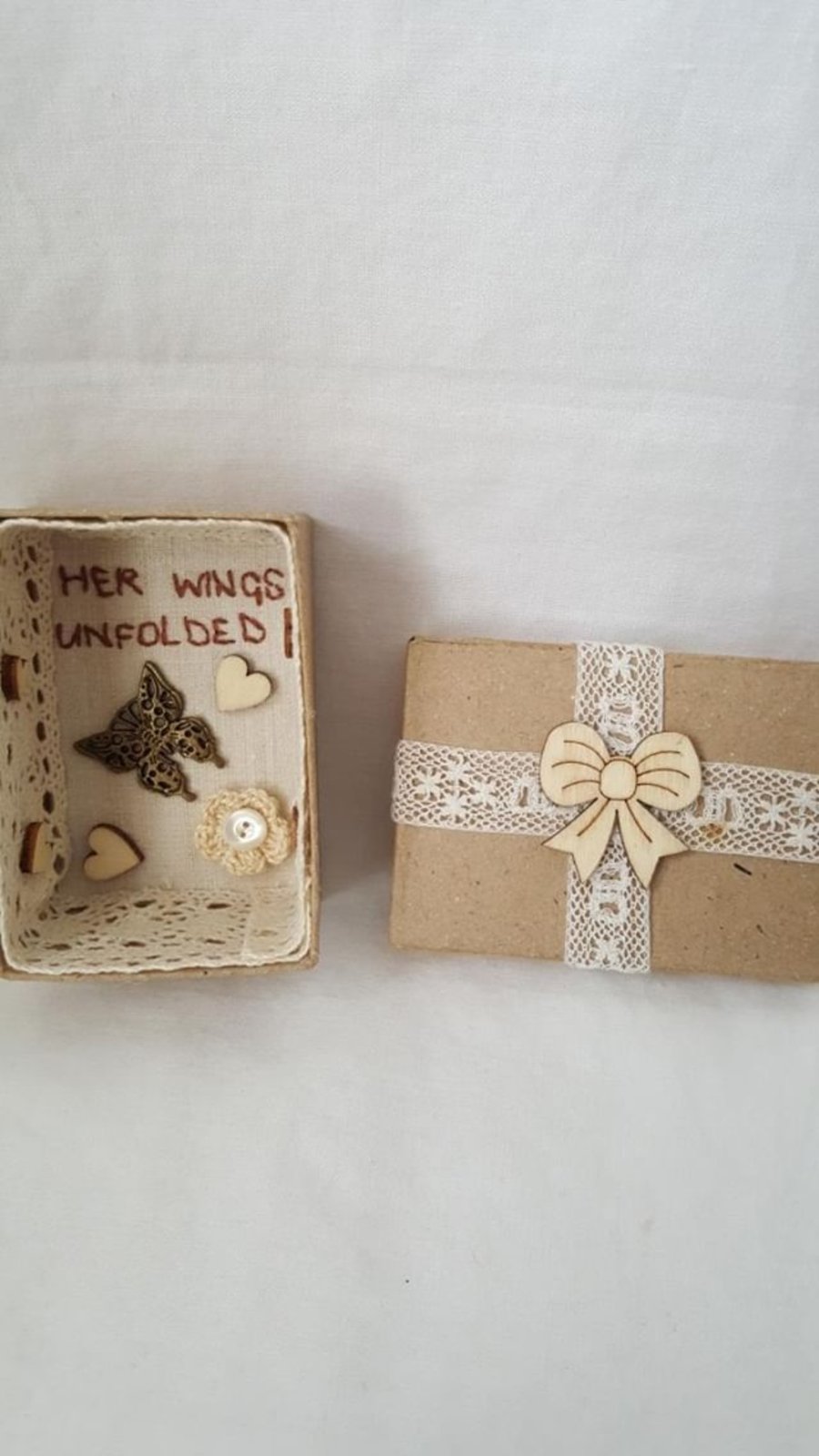 small miniature art diorama with a message 'her wings unfolded'