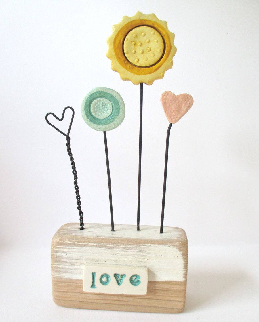 SALE - Clay painted flowers and hearts on wooden block 'love'
