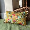 Yellow floral velvet cushion cover with blush pink cotton back and pompoms