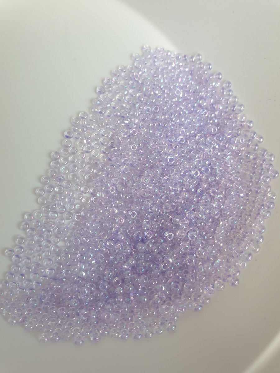 Pale lilac glass seed beads.