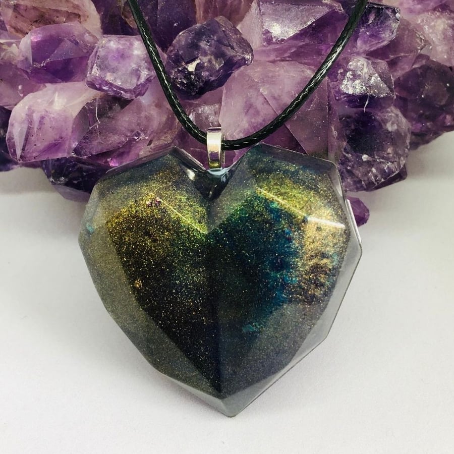 Dark rainbow shimmer heart pendant resin and ink with black cord necklace.