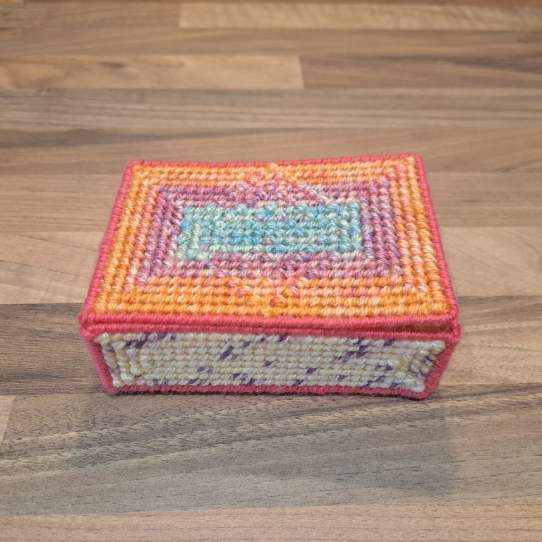 Container for small desk items - with lid and raised pattern