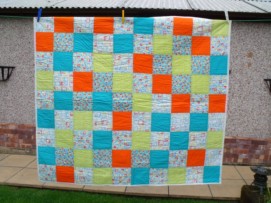 upcycled patchwork quilt in vibrant colours, wheelchair blanket