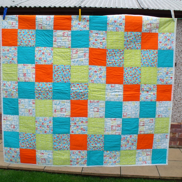 upcycled patchwork quilt in vibrant colours, wheelchair blanket