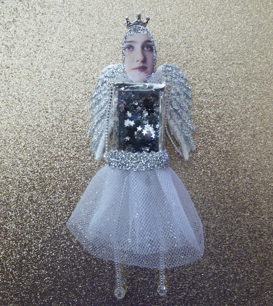 Silver winged angel or Christmas decoration 