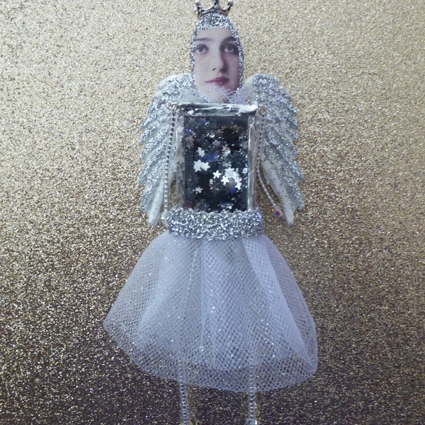 Silver winged angel or Christmas decoration 