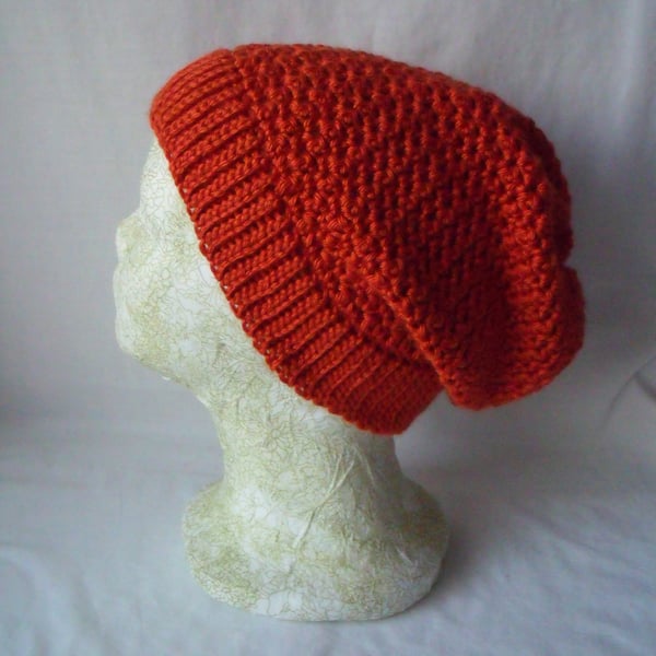 burnt orange coloured crocheted ladies slouch beanie hat