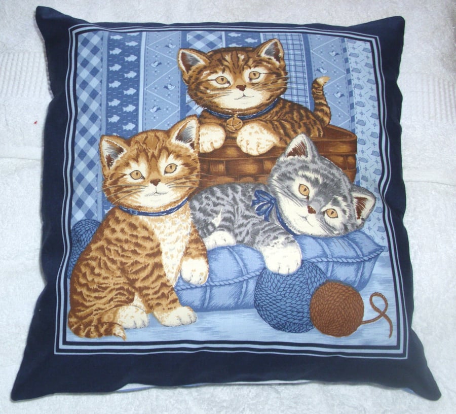 Three pretty Kitties playing with balls of wool cushion