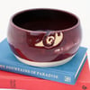 Pottery yarn bowl - stoneware bowl glazed in ruby red with snail curl for your wool