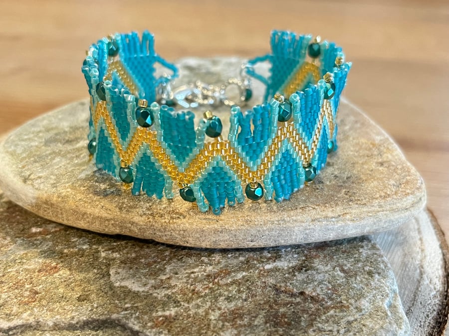 Aqua blue and gold Southwestern inspired beaded peyote fringe bracelet 