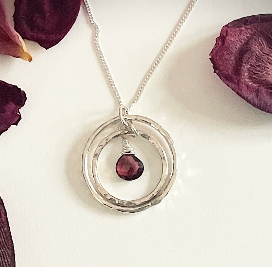 Double circle pendant with ruby garnet