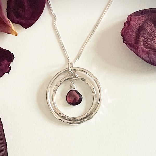 Double circle pendant with ruby garnet