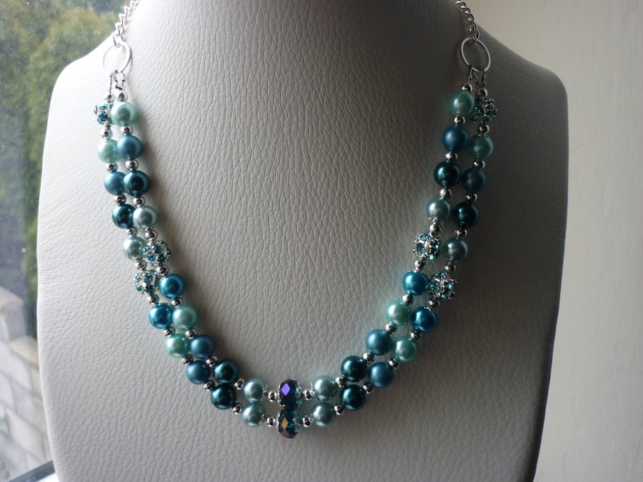 TEAL, BLUE, TURQUOISE AND AQUA CRYSTAL TWO STRAND NECKLACE. 749