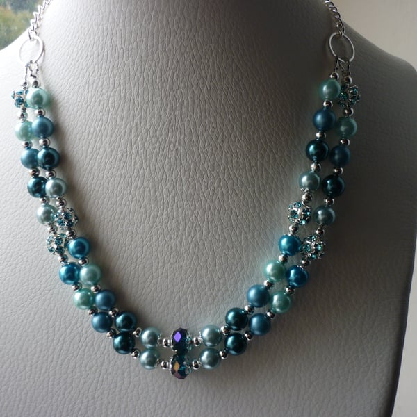 TEAL, BLUE, TURQUOISE AND AQUA CRYSTAL TWO STRAND NECKLACE. 749