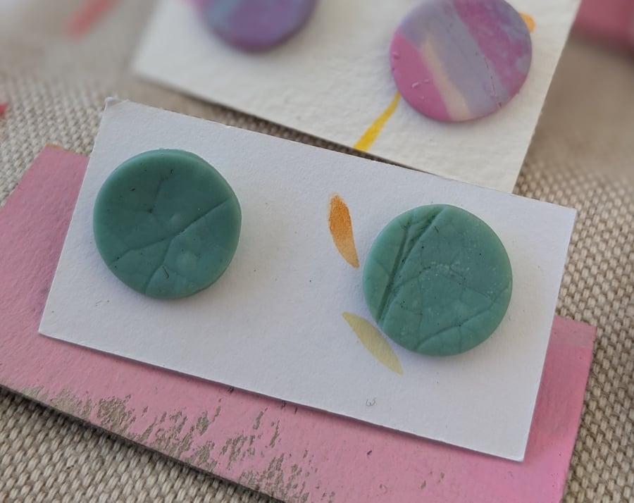 Pale green textured large stud earrings. 