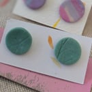 Pale green textured large stud earrings. 