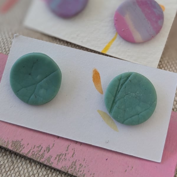 Pale green textured large stud earrings. 