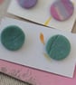 Pale green textured large stud earrings. 