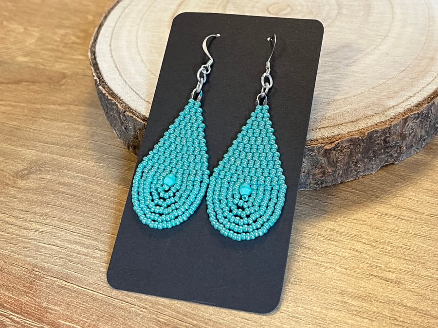 Bright turquoise beaded teardrop earrings