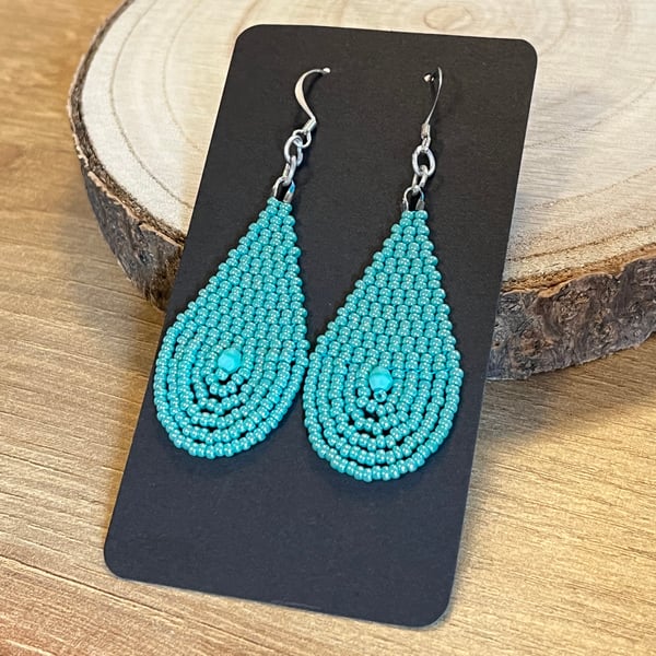 Bright turquoise beaded teardrop earrings