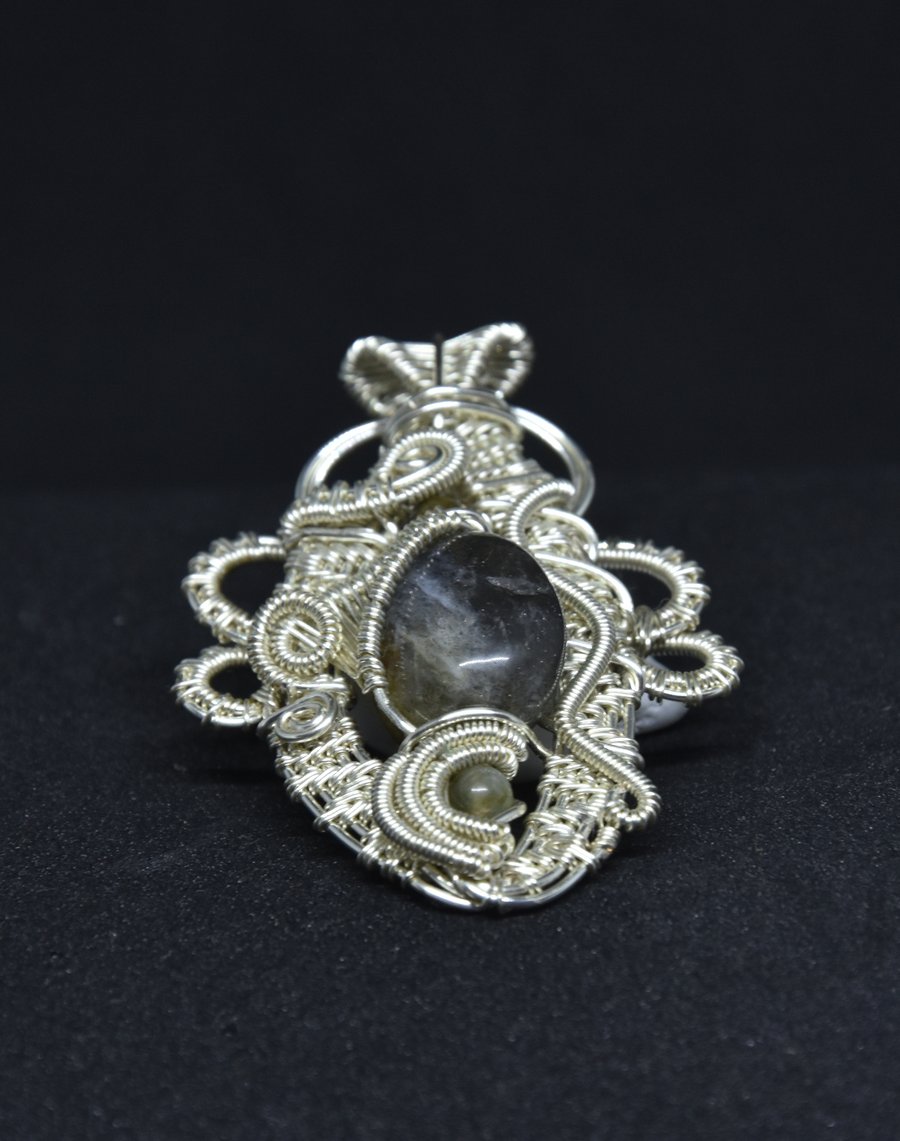 A universe in a stone; labradorite pendant with a galaxy motif; 