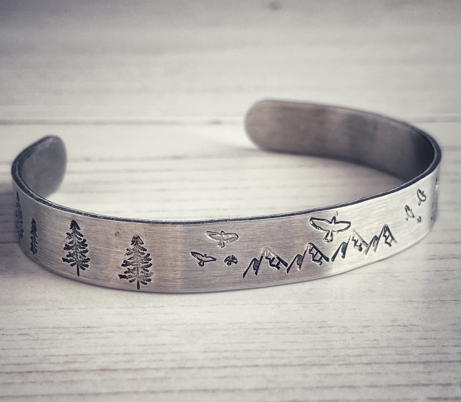 Brushed Aluminium Cuff Bracelet Featuring Trees, Mountains and Birds