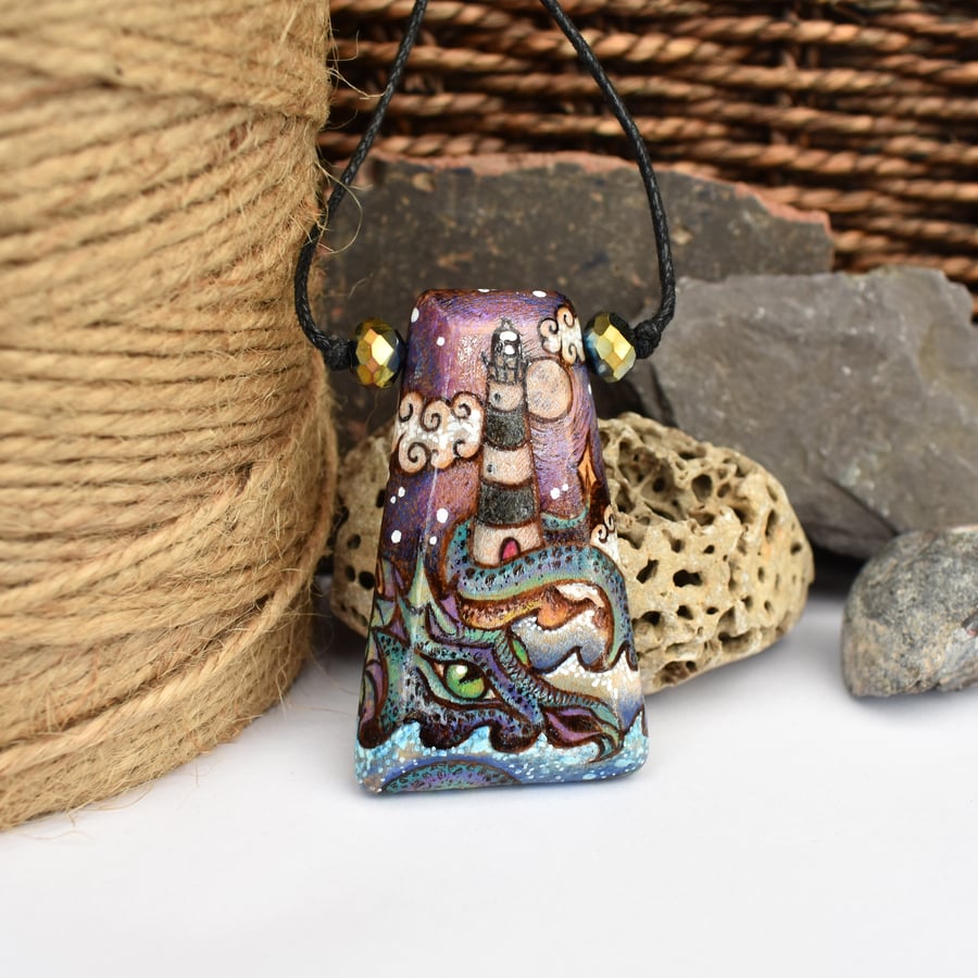 Lighthouse sea dragon, hand burned pyrography pendant.