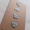Four sea glass buttons in shades of light aqua