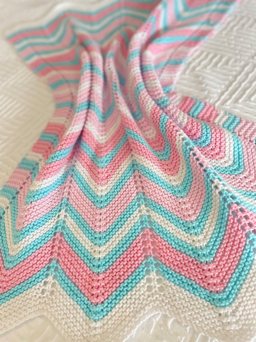 Pink, white and turquoise, hand knitted baby blanket.