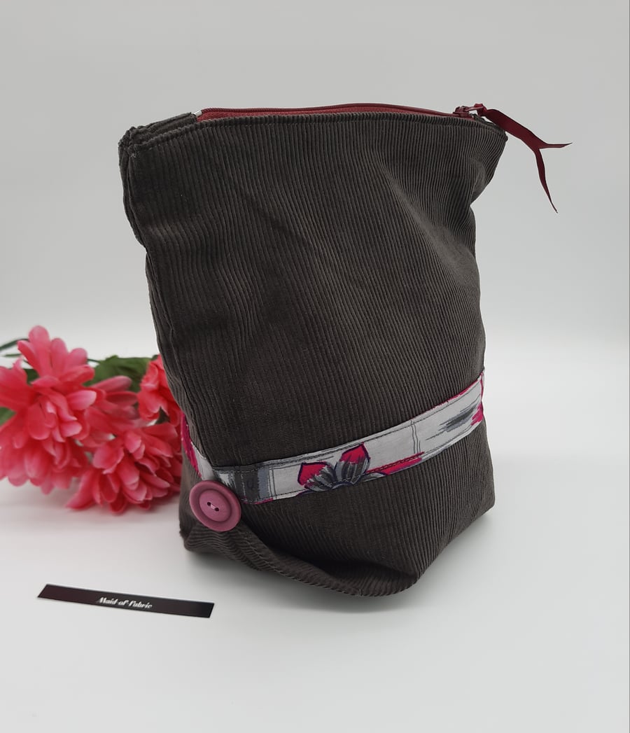 Make up bag,  grey corduroy,  pink and grey lining,  pink buttons, zipped case. 