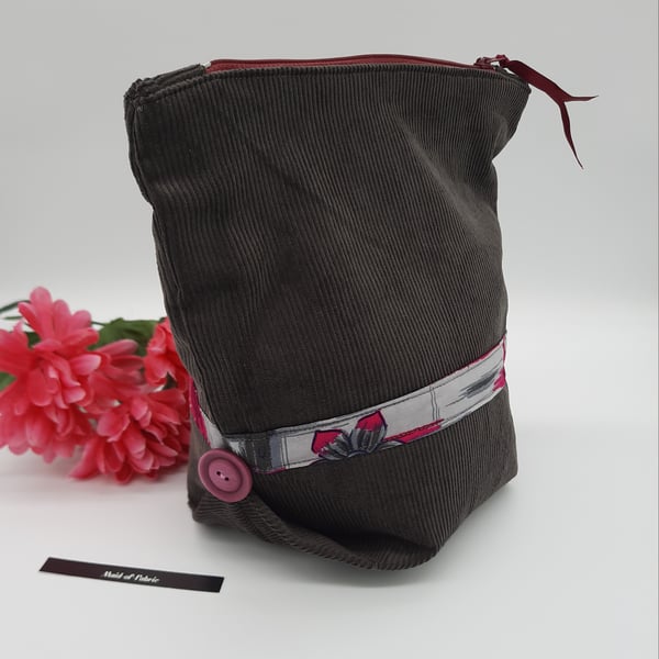 Make up bag,  grey corduroy,  pink and grey lining,  pink buttons, zipped case. 