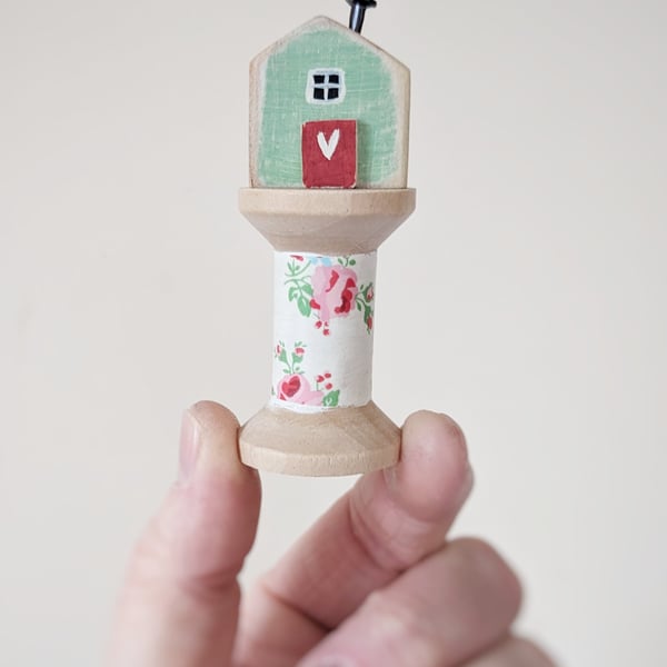 Little Wooden House on a Floral Wooden Bobbin 