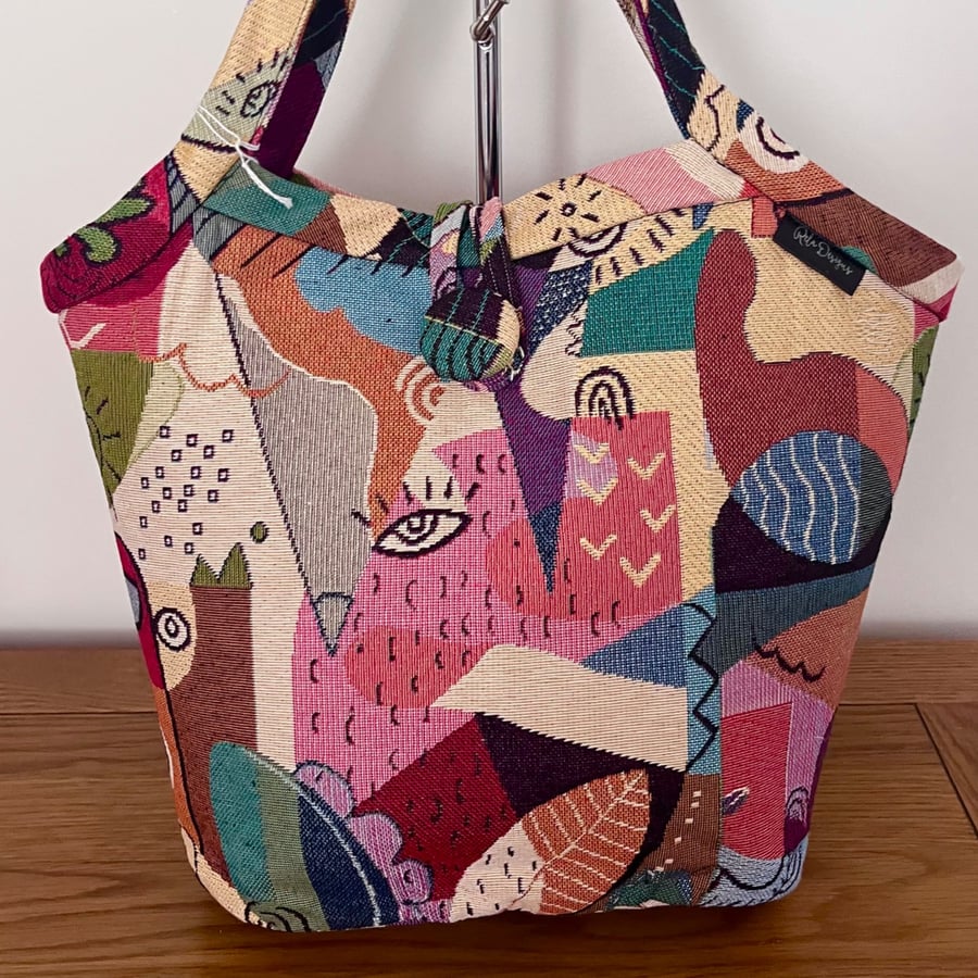 Image of Bucket bags tote bags abstract faces 