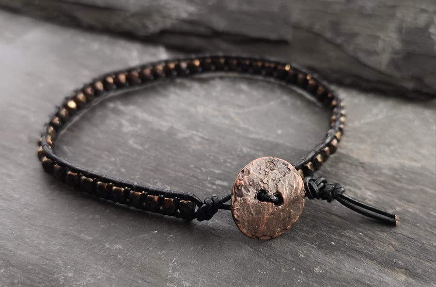 Black leather and glass bead bracelet with copper button